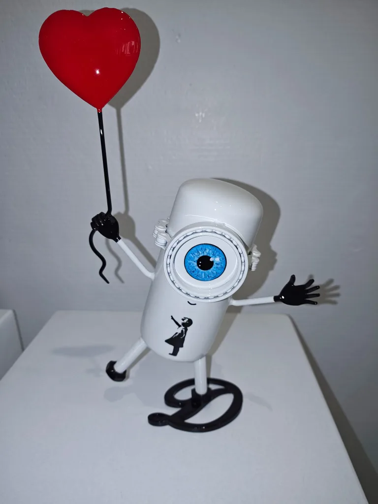 Petit Banksy (œil bleu, socle D Noir) — Vincent Duchêne